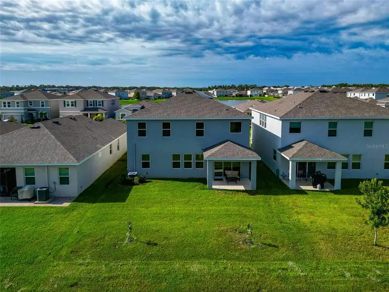 Front exterior of a new home in , Apollo Beach, FL, highlighting curb appeal (Image 1).
