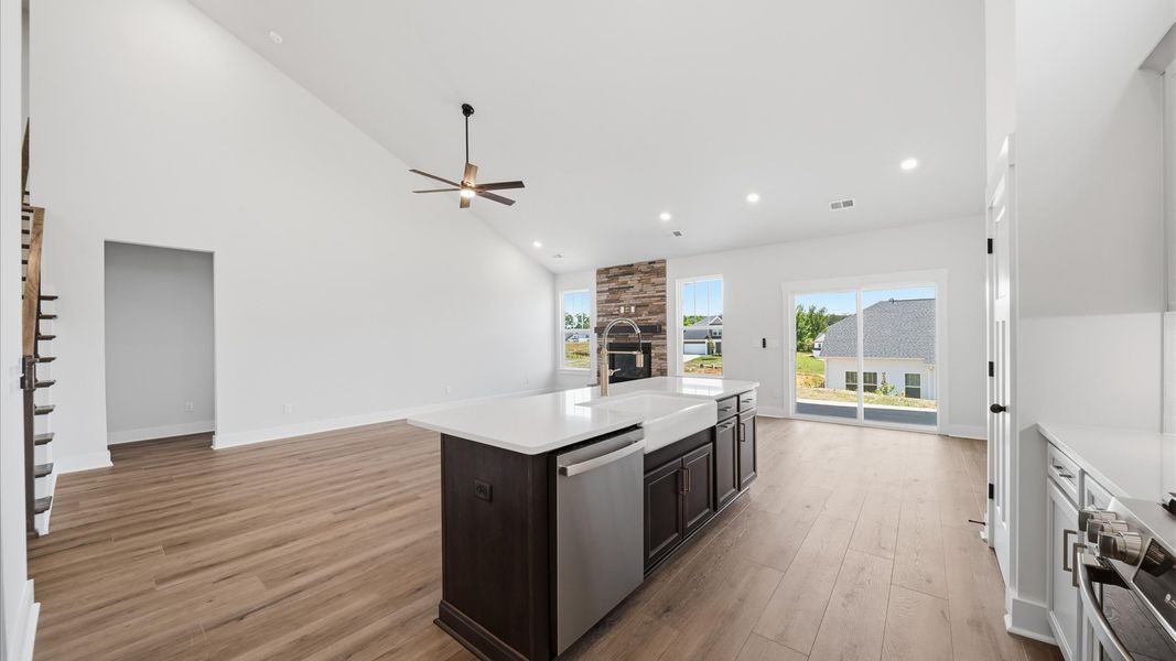 Highly skilled craftsmanship shines in this modern kitchen with open sightlines and a central island focal point