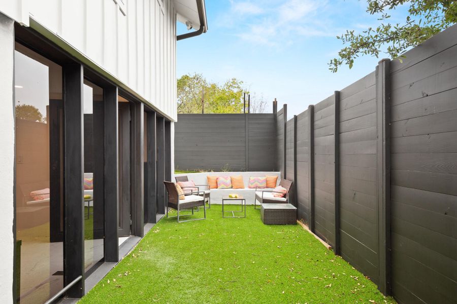 View of yard lower yard area with an outdoor hangout area and a patio