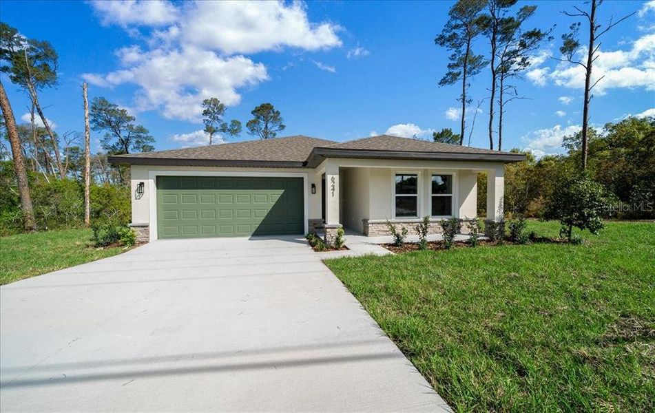 Front exterior of a new home in , Spring Hill, FL, highlighting curb appeal (Image 27). Front exterior of a new home in , Spring Hill, FL, highlighting curb appeal (Image 27).