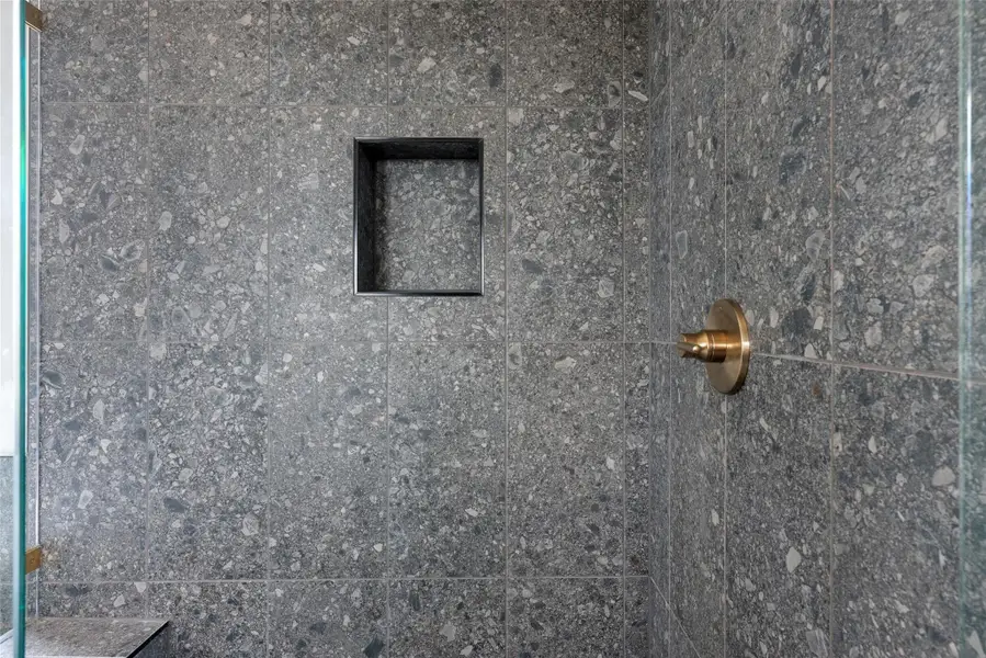Bathroom view of a marble finish shower