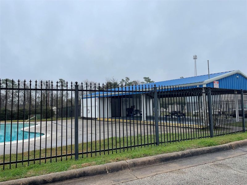 Subdivision swimming pool located on the shore of Lake Conroe