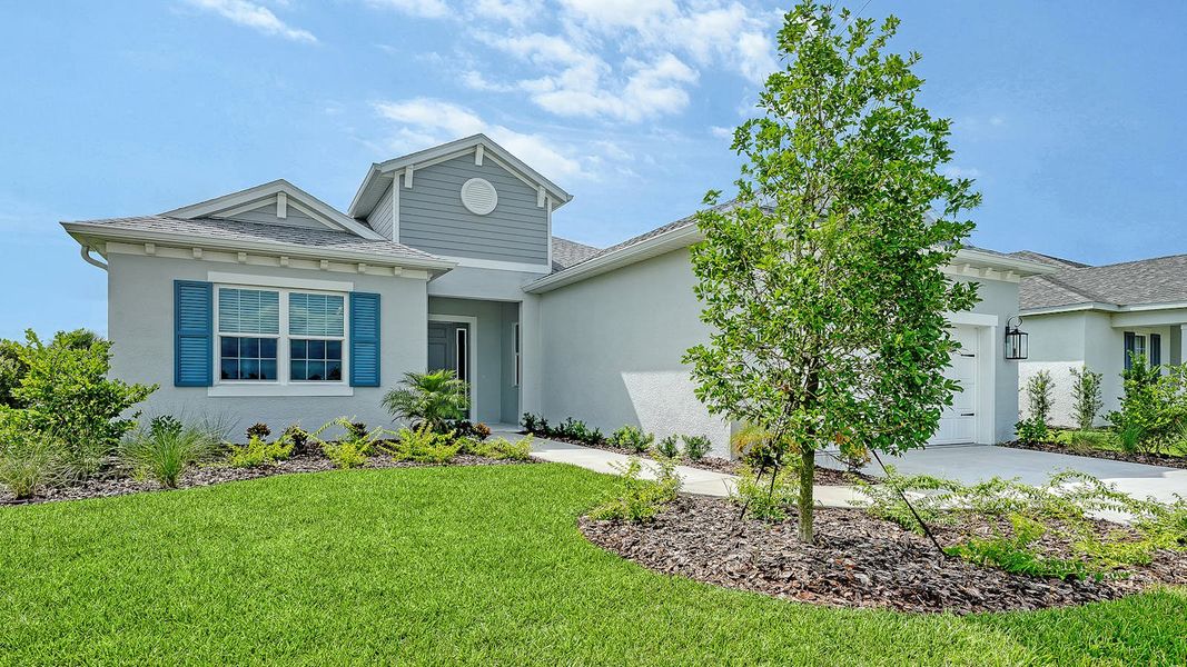 Front exterior of a new home in Canoe Creek Real Estate and Homes for Sale in Parrish, FL - Neal Communities, Parrish, FL, highlighting curb appeal (Image 2). Front exterior of a new home in Canoe Creek Real Estate and Homes for Sale in Parrish, FL - Neal Communities, Parrish, FL, highlighting curb appeal (Image 2).