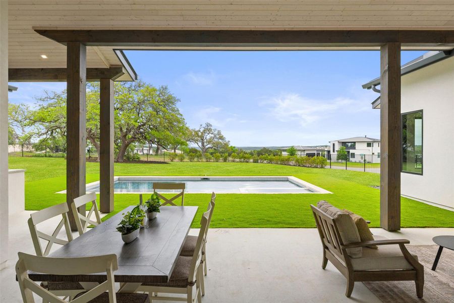 View of patio / terrace with an outdoor pool and outdoor dining area View of patio / terrace with an outdoor pool and outdoor dining area
