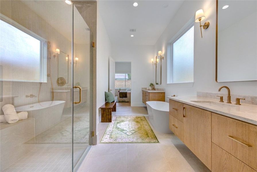 A true retreat, the primary bath blends timeless finishes with a spacious walk-in shower and tranquil soaking tub designed for everyday relaxation.