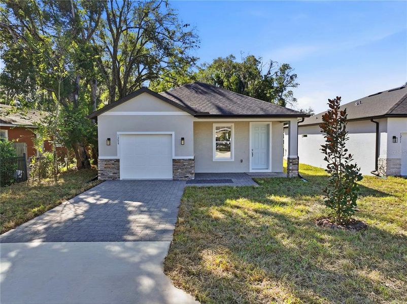 Front exterior of a new home in , Sanford, FL, highlighting curb appeal (Image 18).