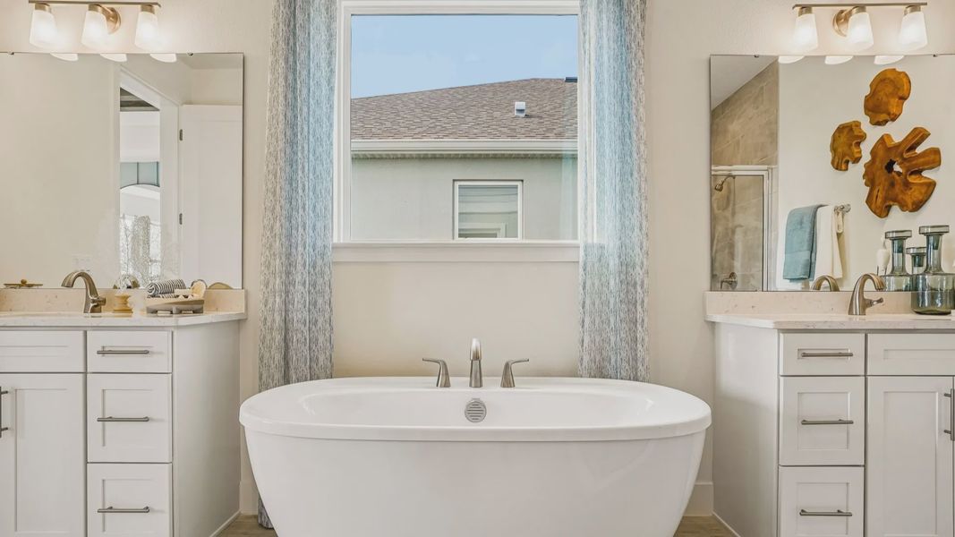 Oleander Primary Suite En Suite Bath by DRB Homes in Ardisia Park in New Smyrna Beach, FL