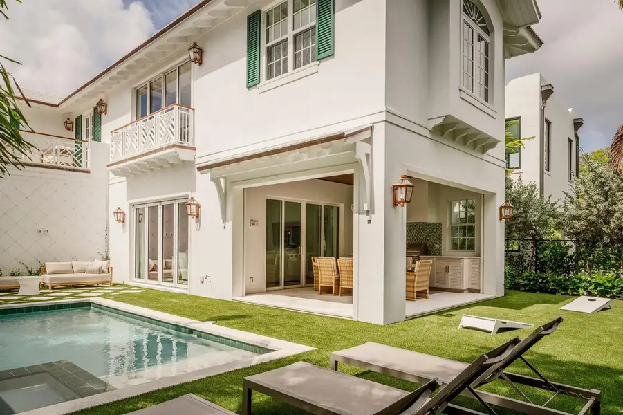 04 - White home exterior with covered pa