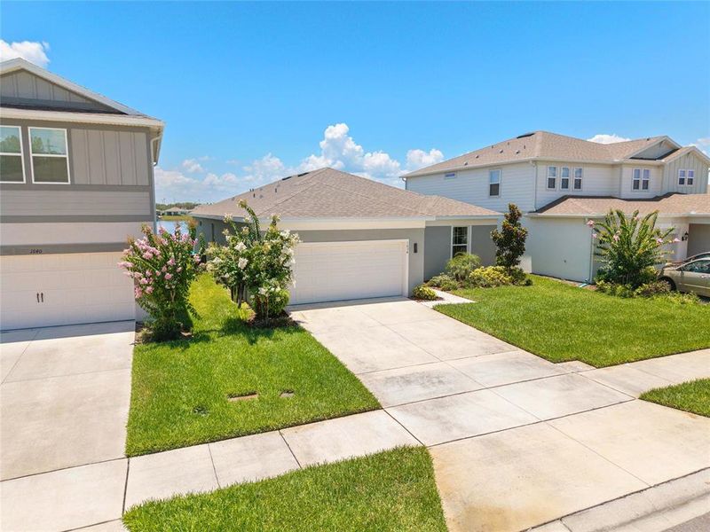 Front exterior of a new home in , St. Cloud, FL, highlighting curb appeal (Image 21).