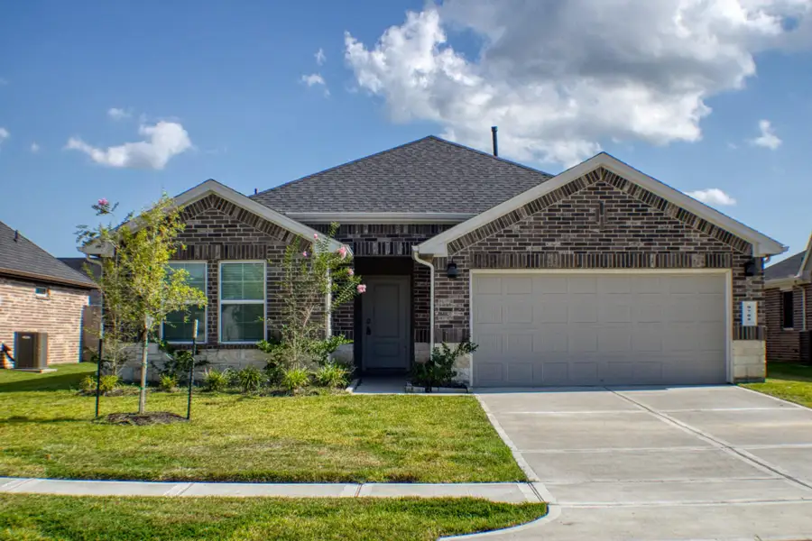 Front exterior of a new home in Central Park, Texas City, TX, highlighting curb appeal (Image 2). Front exterior of a new home in Central Park, Texas City, TX, highlighting curb appeal (Image 2).