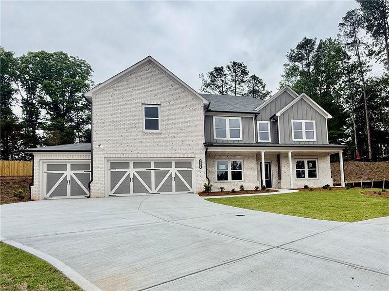 Front exterior of a new home in , Hoschton, GA, highlighting curb appeal (Image 1). Front exterior of a new home in , Hoschton, GA, highlighting curb appeal (Image 1).