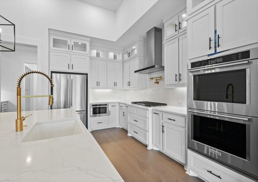 The kitchen has goregous white tile backsplash.