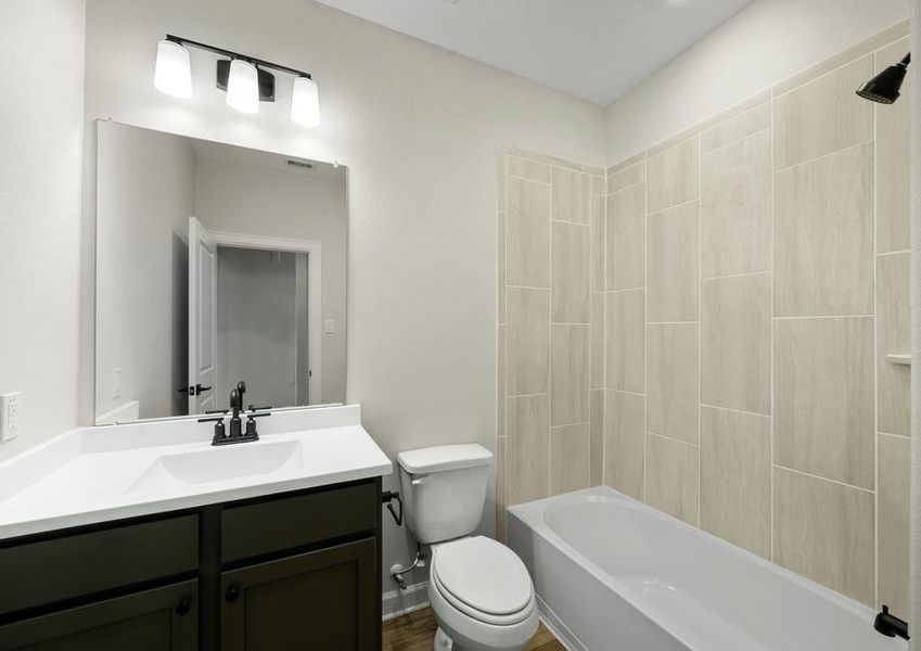 Gorgeous tile detail is featured in the secondary bathroom.