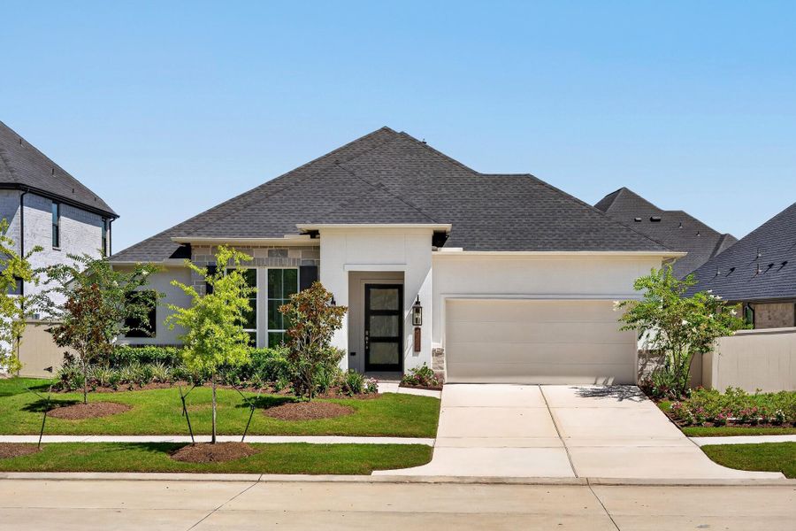 Front exterior of a new home in Audubon 60′, Magnolia, TX, highlighting curb appeal (Image 27).