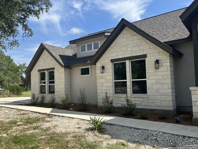 Front exterior of a new home in , Spring Branch, TX, highlighting curb appeal (Image 21).
