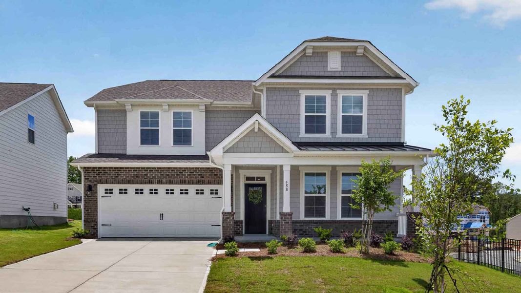 Front exterior of a new home in Westport, York, SC, highlighting curb appeal (Image 1). Front exterior of a new home in Westport, York, SC, highlighting curb appeal (Image 1).