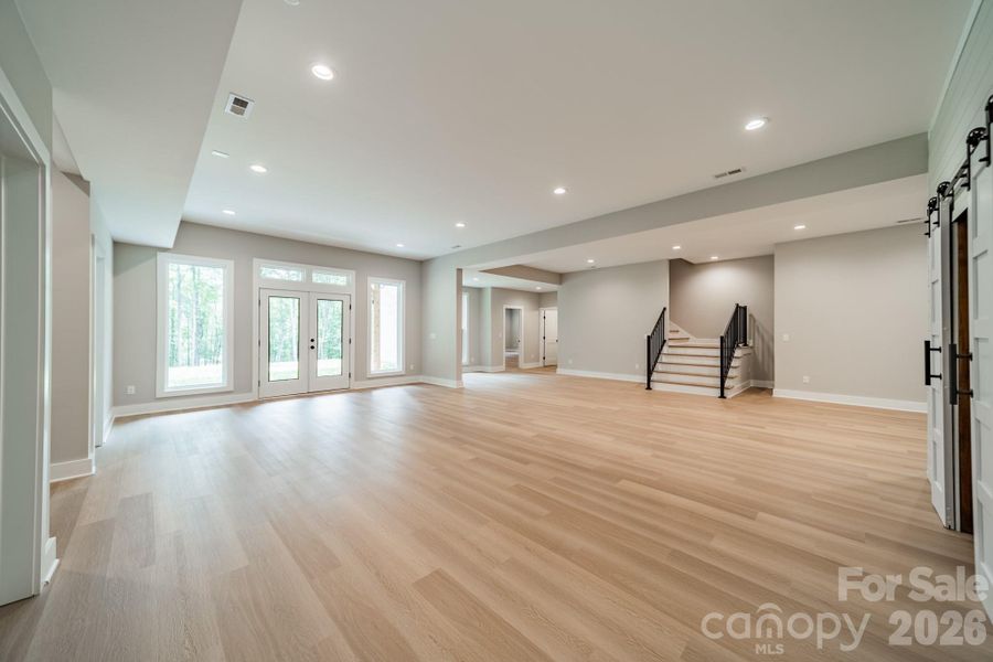 The Lower Level Living room is expansive and leads you to Lake Norman