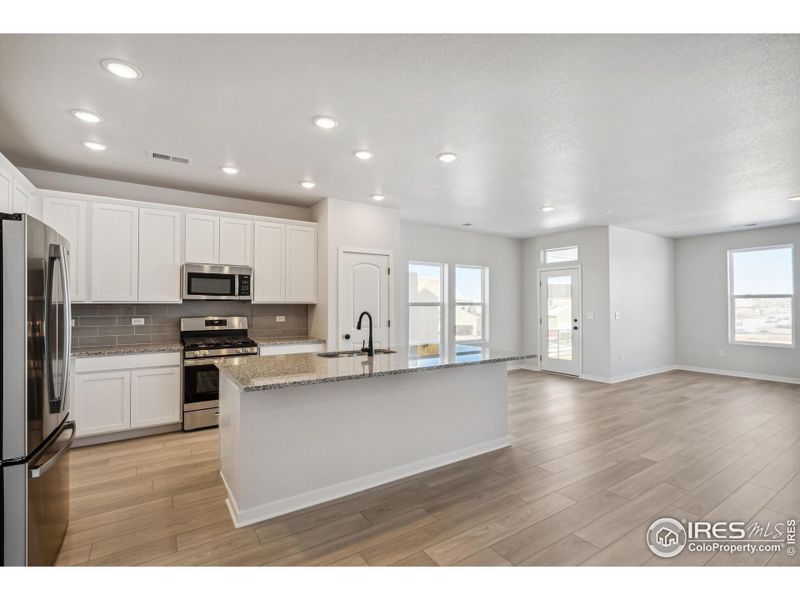 Furnished interior view inside a new home in Kinston Mainstreet Townhomes, Loveland (Image 5).