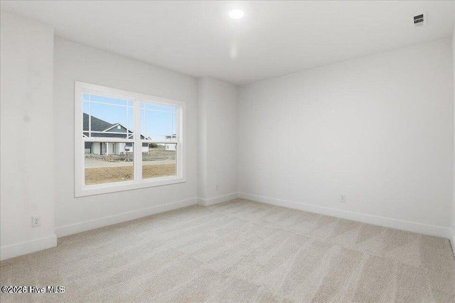 Spacious, unfurnished interior of a new home in Wood Creek Landing, Leland (Image 24).