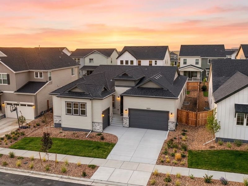 Front exterior of a new home in Trailstone, Arvada, CO, highlighting curb appeal (Image 1). Front exterior of a new home in Trailstone, Arvada, CO, highlighting curb appeal (Image 1).