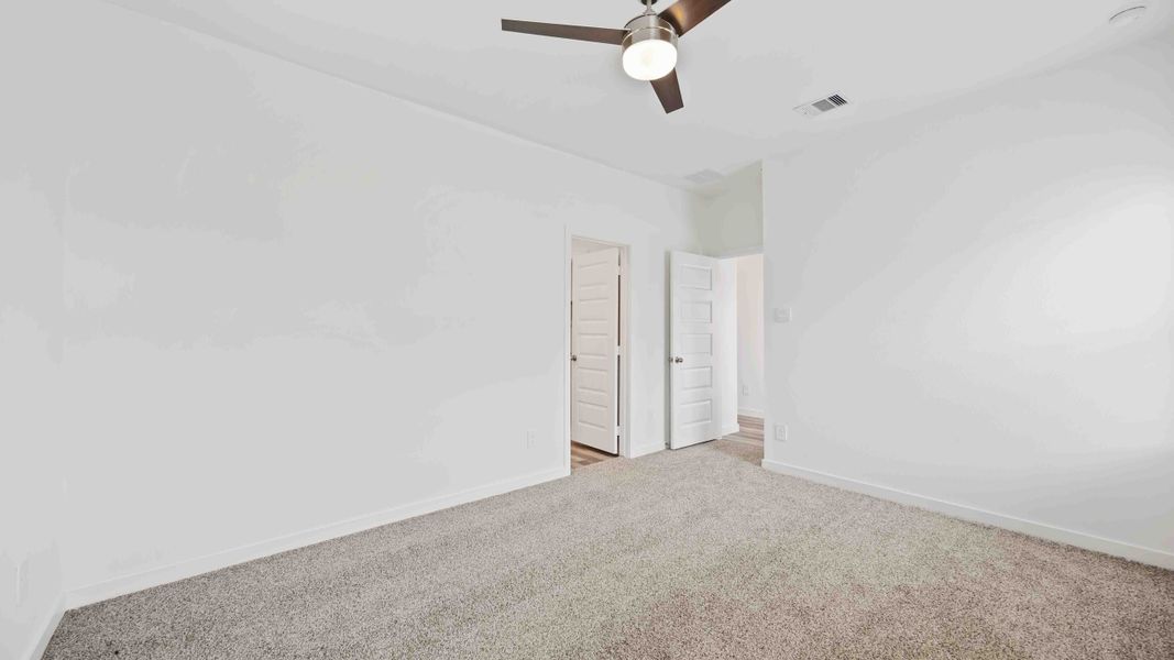 Representative unfurnished interior of a home built from the Magnolia by D.R. Horton in Grand West, Houston (Image 15).