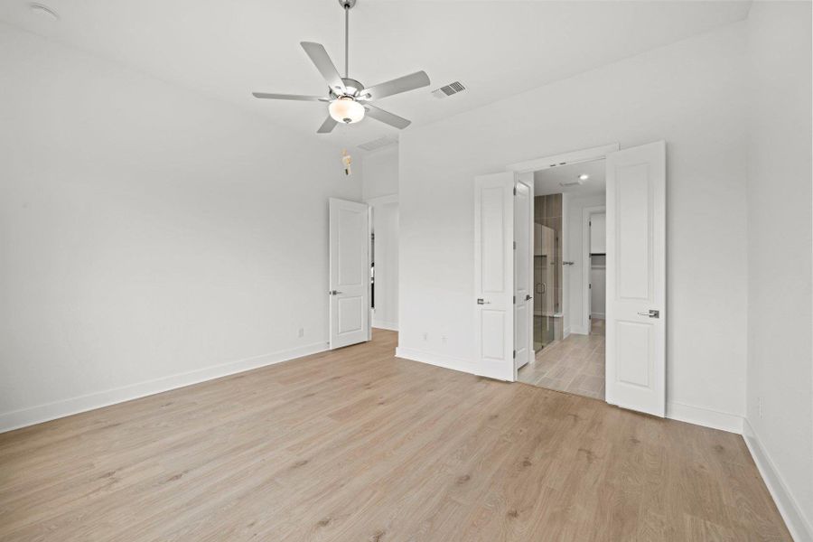 Primary Bedroom with elevated ceiling