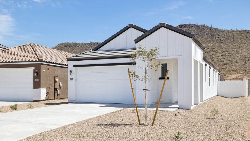 Front exterior of a new home in The Buttes at Mystic, Peoria, AZ, highlighting curb appeal (Image 23).