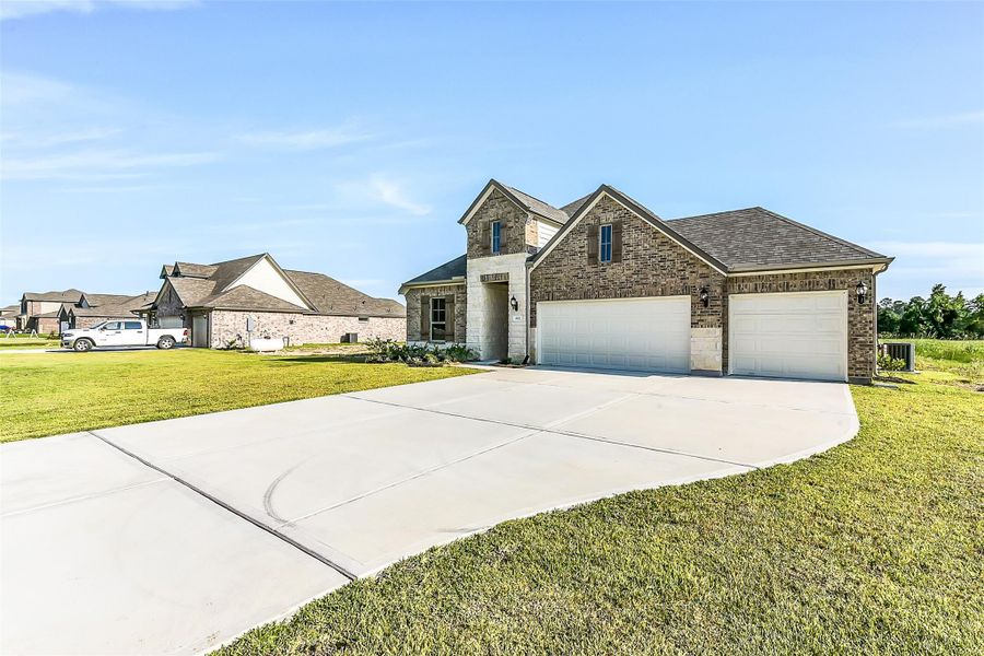 Front exterior of a new home in , Cleveland, TX, highlighting curb appeal (Image 20). Front exterior of a new home in , Cleveland, TX, highlighting curb appeal (Image 20).