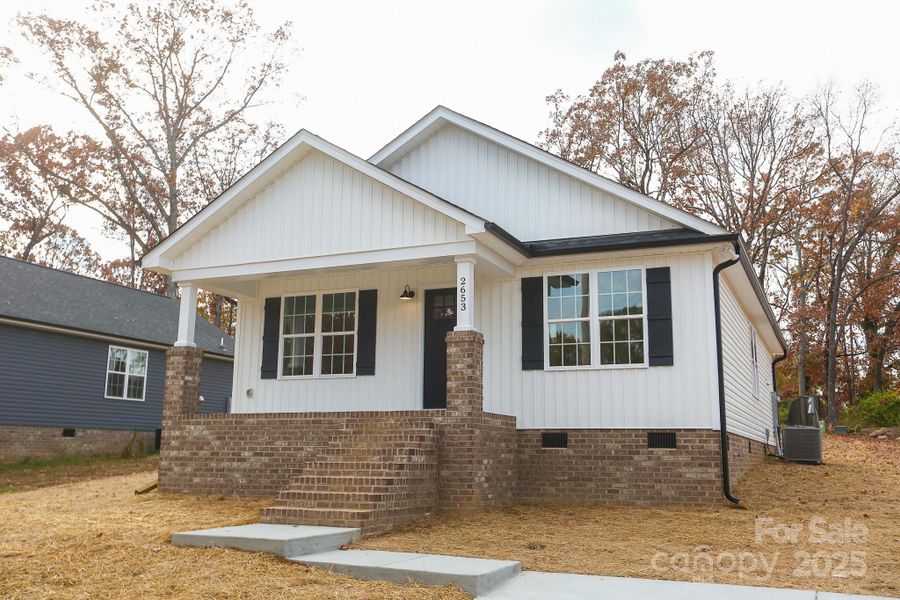 Front exterior of a new home in , Kannapolis, NC, highlighting curb appeal (Image 1).