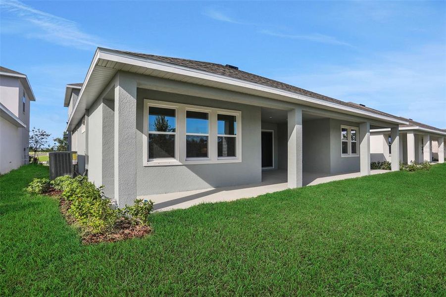 Exterior details and patio area of a home in Seaire, Parrish (Image 21).