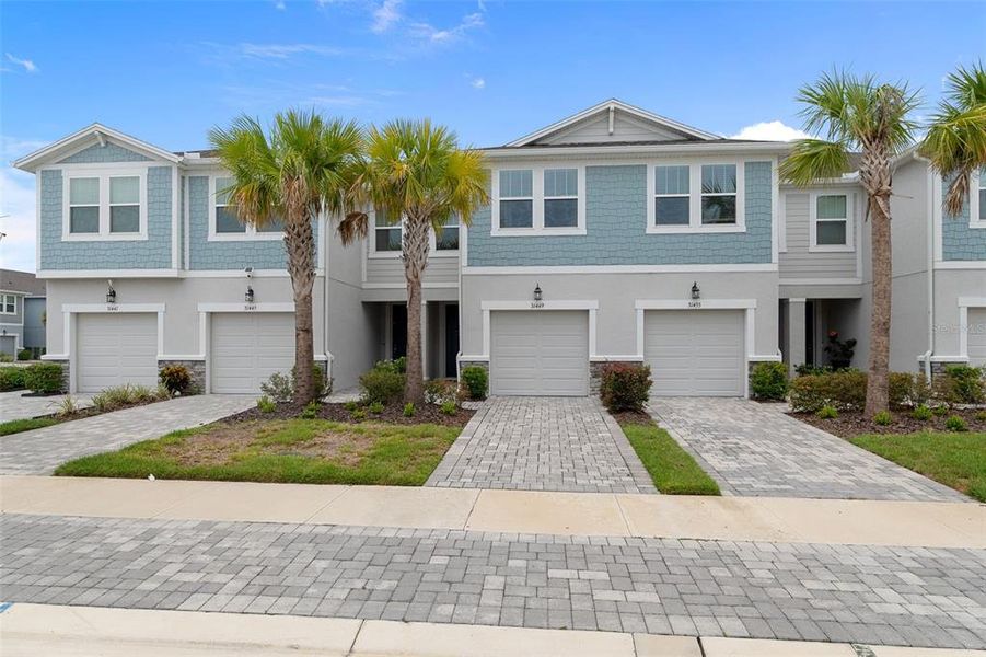 Front exterior of a new home in , Wesley Chapel, FL, highlighting curb appeal (Image 24).