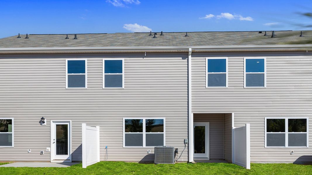 Exterior details and patio area of a home in Brookside Ridge Townhomes, Greer (Image 3).