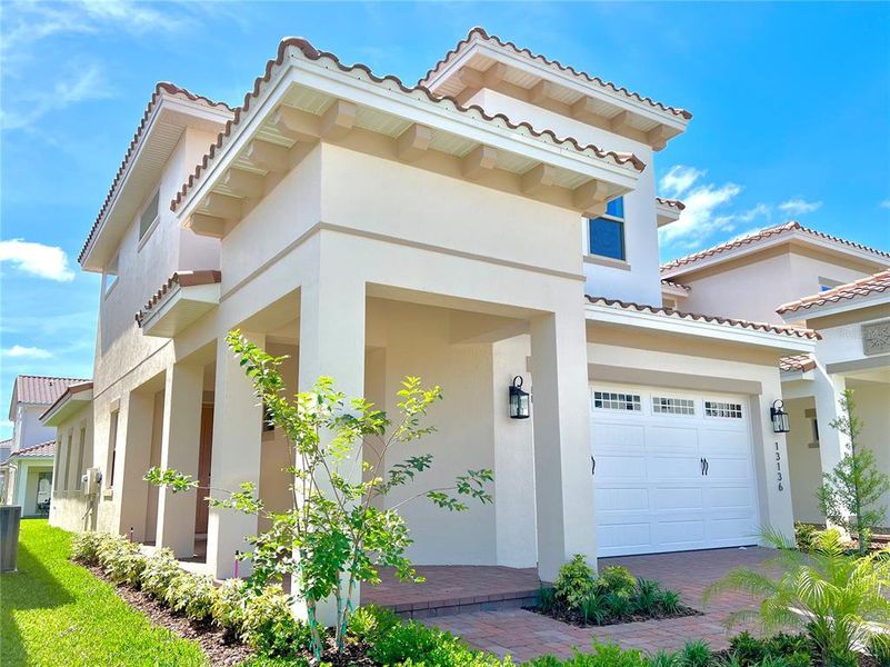 Front exterior of a new home in , Orlando, FL, highlighting curb appeal (Image 27).