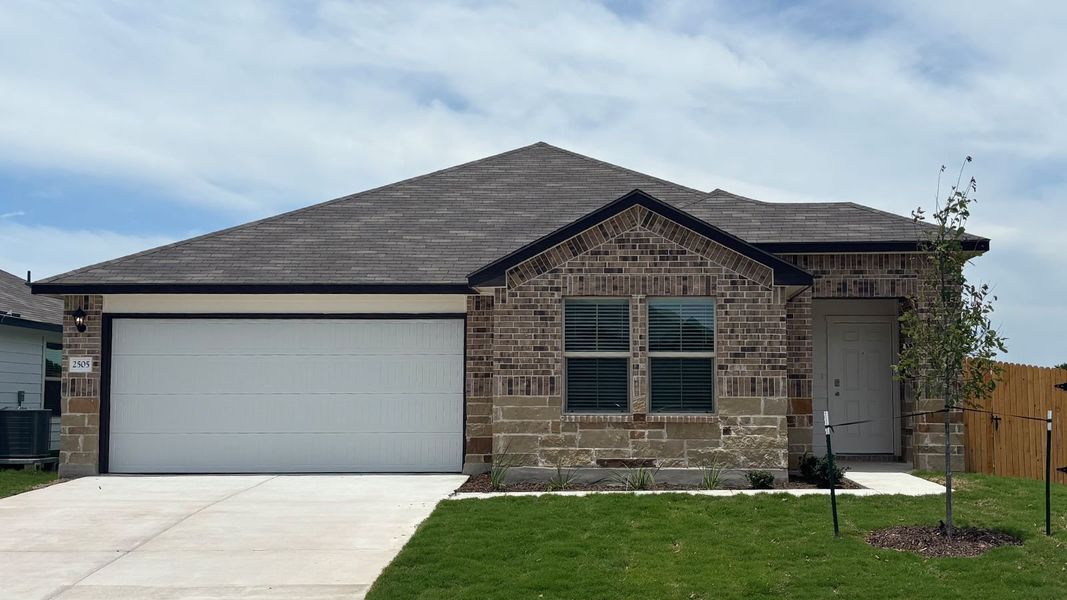Front exterior of a new home in Pecan Creek, Temple, TX, highlighting curb appeal (Image 1). Front exterior of a new home in Pecan Creek, Temple, TX, highlighting curb appeal (Image 1).