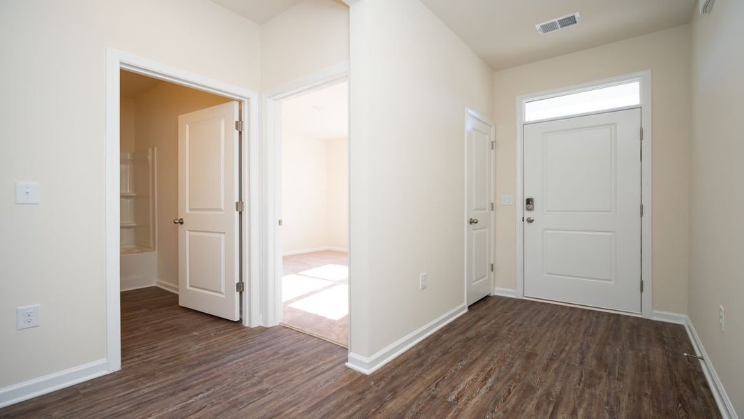 Representative unfurnished interior of a home built from the CALI by D.R. Horton in The Reserve at Wild Horse, Conway (Image 12).