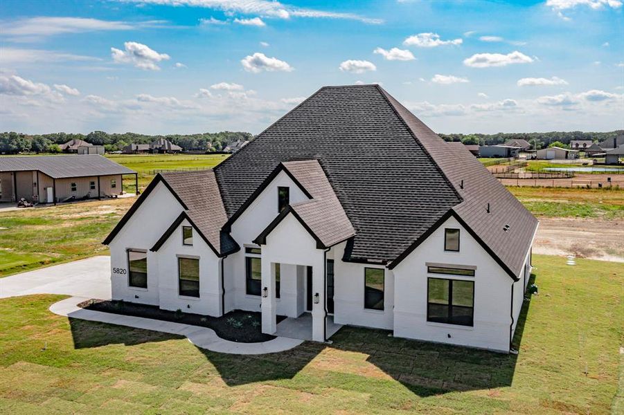 View of front of home with a front lawn