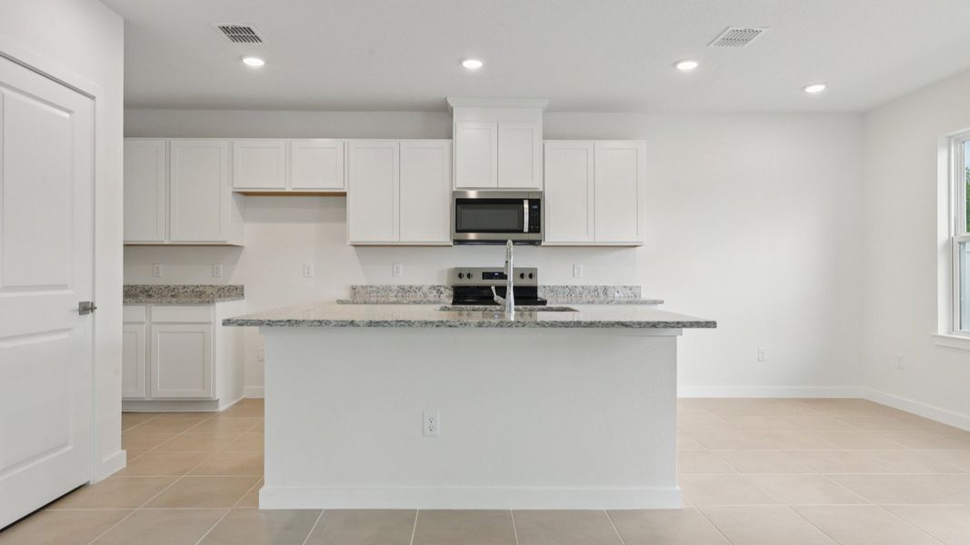 Kitchen of the Coronado - End at Cyrene at Harmony located in St Cloud FL by DRB Homes