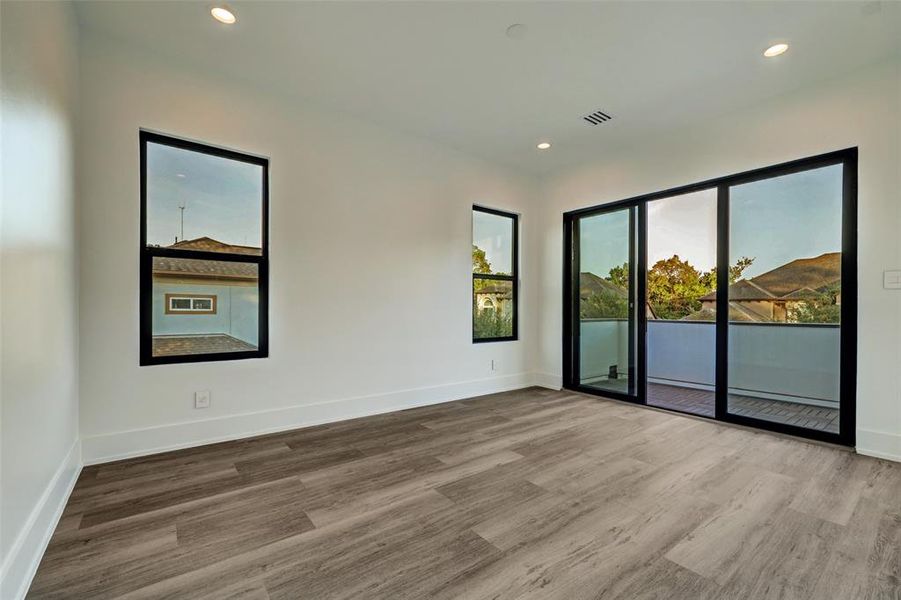 Bedroom with shared access to balcony.