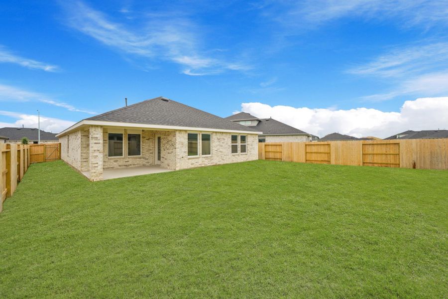 Exterior details and patio area of a home in Sunterra, Katy (Image 3).