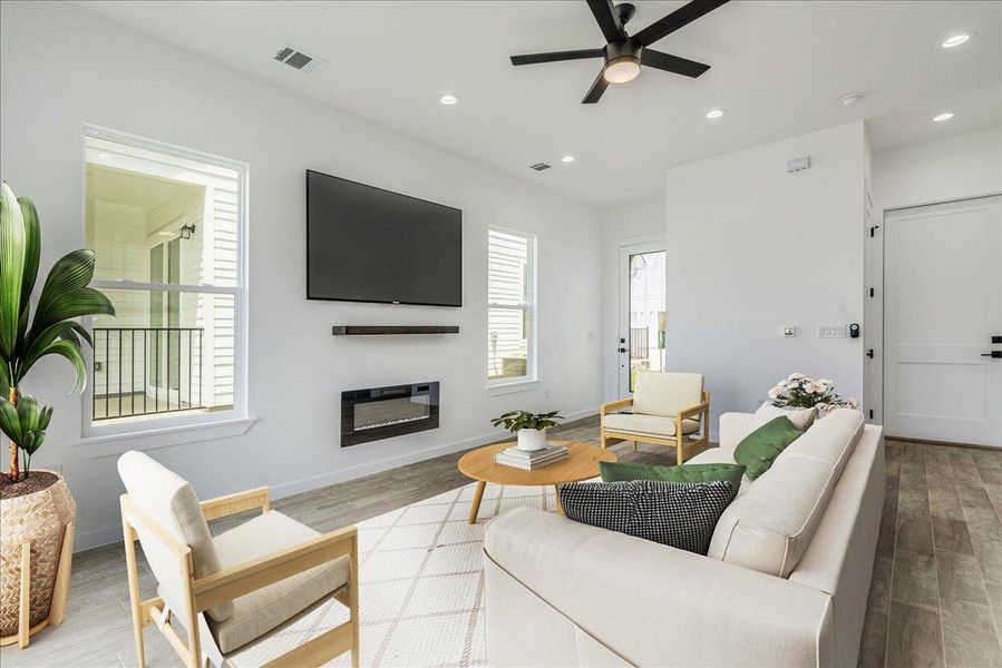 Open living area with kitchen, dining, and access to outdoor patio. Open living area with kitchen, dining, and access to outdoor patio.