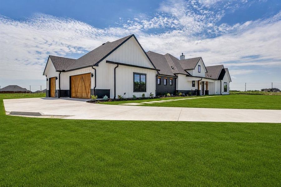 Front exterior of a new home in , Northlake, TX, highlighting curb appeal (Image 1). Front exterior of a new home in , Northlake, TX, highlighting curb appeal (Image 1).