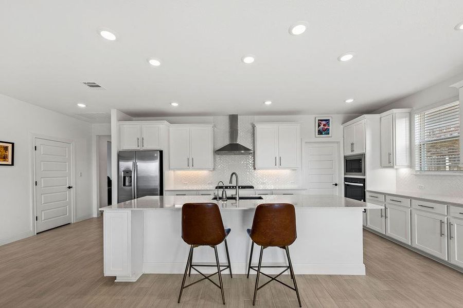 The main center of this home is the gorgeous, extended gourmet kitchen!