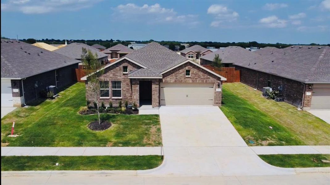 Front exterior of a new home in Meadowbrook Estates, Cleburne, TX, highlighting curb appeal (Image 2). Front exterior of a new home in Meadowbrook Estates, Cleburne, TX, highlighting curb appeal (Image 2).