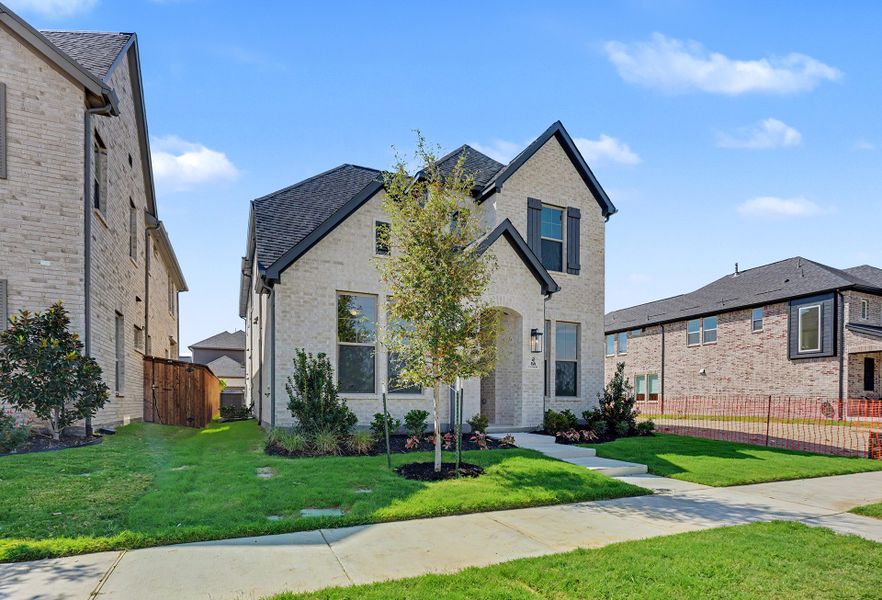 Front exterior of a new home in Light Farms Brenham - 40' Lots, Celina, TX, highlighting curb appeal (Image 21).