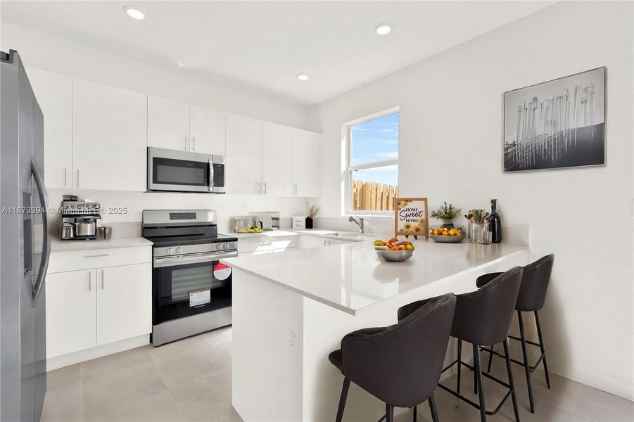 Furnished interior view inside a new home in Cedar Pointe: Cypress Collection, Homestead (Image 10).