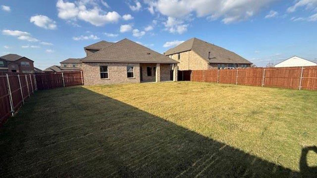 Exterior details and patio area of a home in Fireside by the Lake, Garland (Image 3).