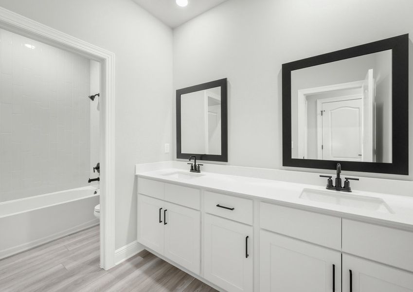 The secondary bathroom boasts this stunning dual-sink vanity!