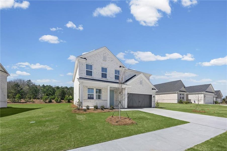 Front exterior of a new home in Overland, Locust Grove, GA, highlighting curb appeal (Image 2). Front exterior of a new home in Overland, Locust Grove, GA, highlighting curb appeal (Image 2).