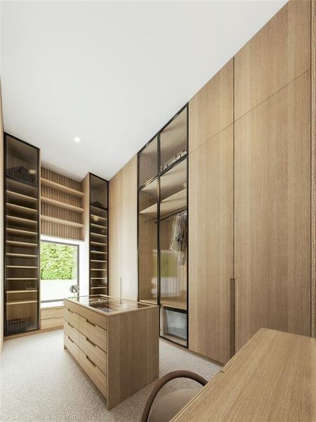 Custom closet system featuring light wood-finish cabinetry, a central storage island with a glass top, and integrated shelving