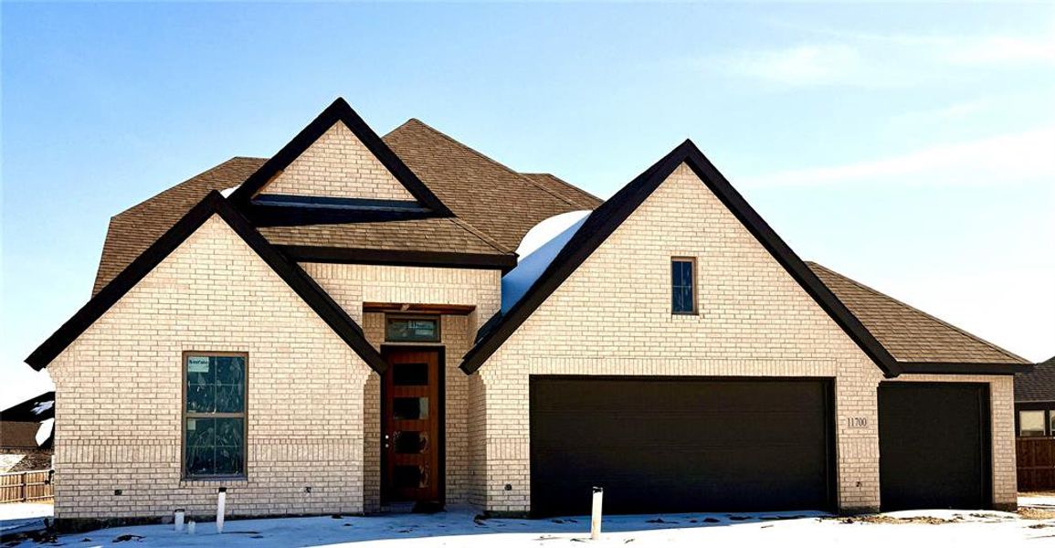 Front exterior of a new home in , Godley, TX, highlighting curb appeal (Image 1). Front exterior of a new home in , Godley, TX, highlighting curb appeal (Image 1).